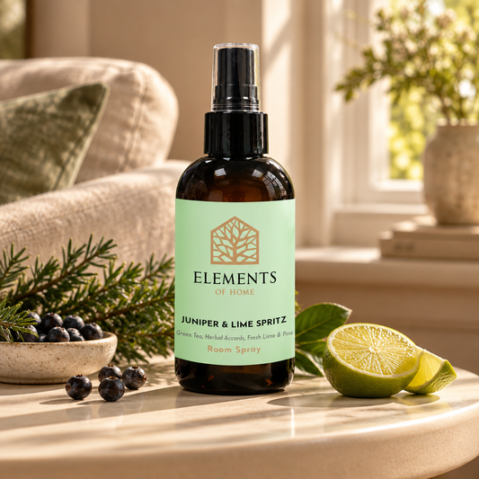 Juniper & Lime Spritz room spray on a side table in a sunlit living room – Elements of Fragrance