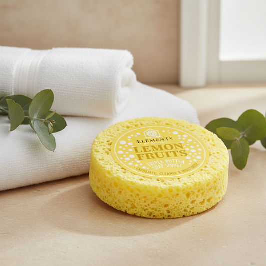Lemon Fruits triple butter soap sponge on a bathroom shelf with white towels – Elements of Fragrance