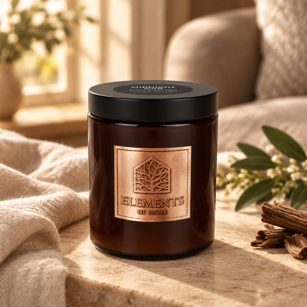 Midnight Oud 140g luxury candle in an amber glass jar in a cosy living room – Elements of Fragrance