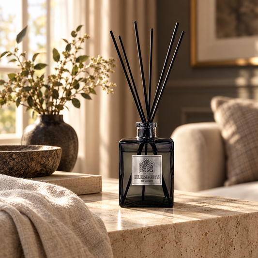 Midnight Oud 200ml luxury reed diffuser in a black glass bottle styled in a sunlit living room – Elements of Fragrance
