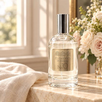 No10 Inspired by Snow Fairy 100ml eau de parfum styled on a marble table in a sunlit room – Elements of Fragrance