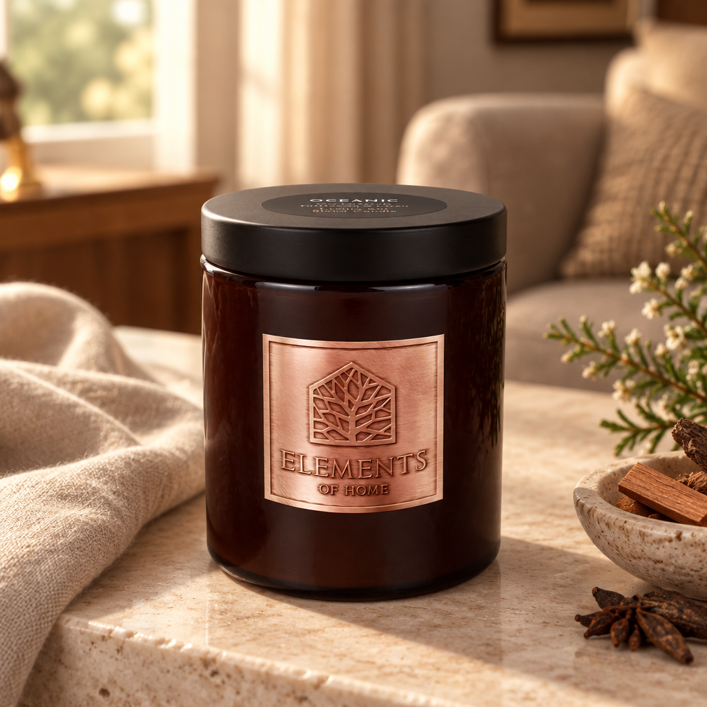 Oceanic 140g luxury candle in an amber glass jar in a cosy living room – Elements of Fragrance