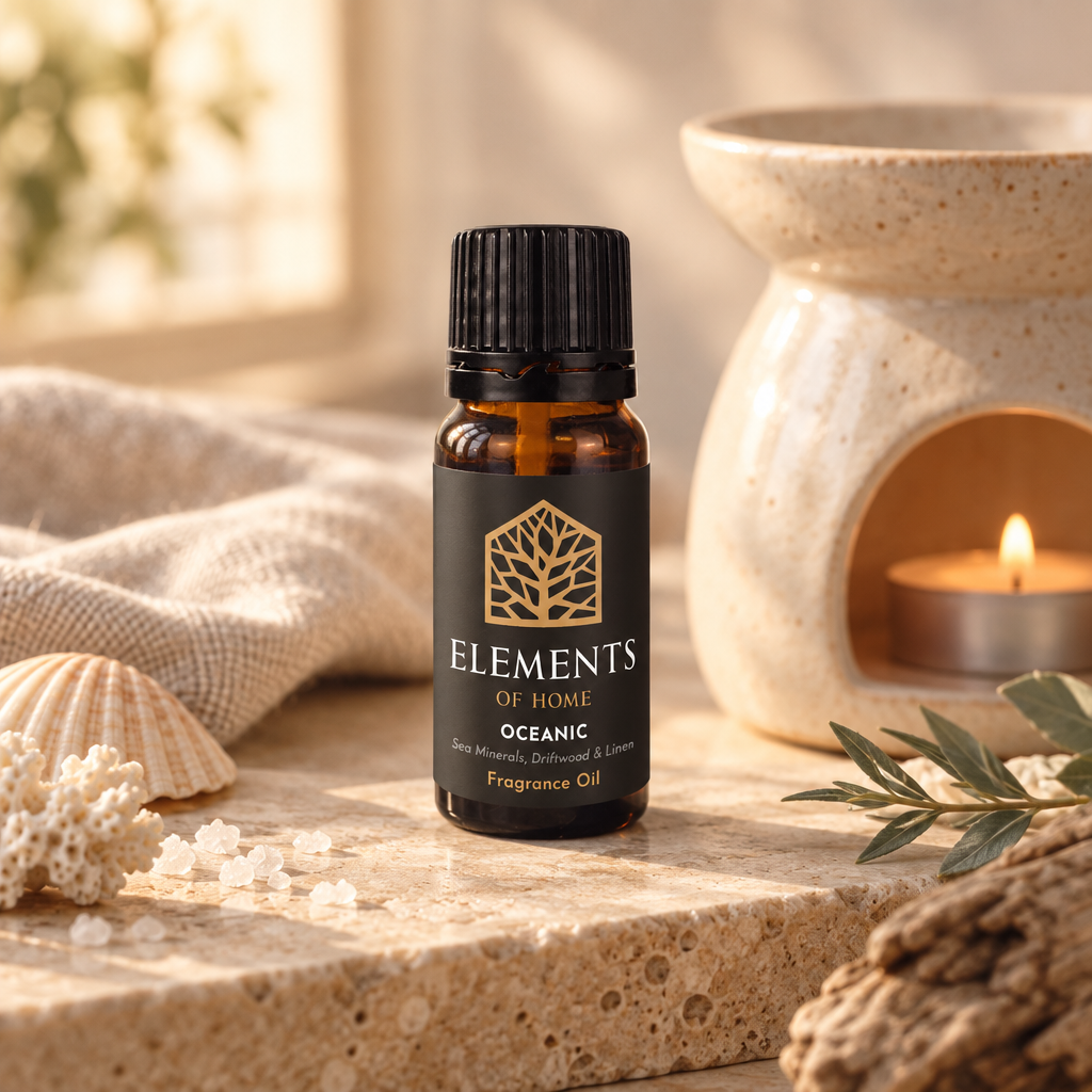 Oceanic 10ml fragrance oil beside a lit ceramic oil burner – Elements of Fragrance