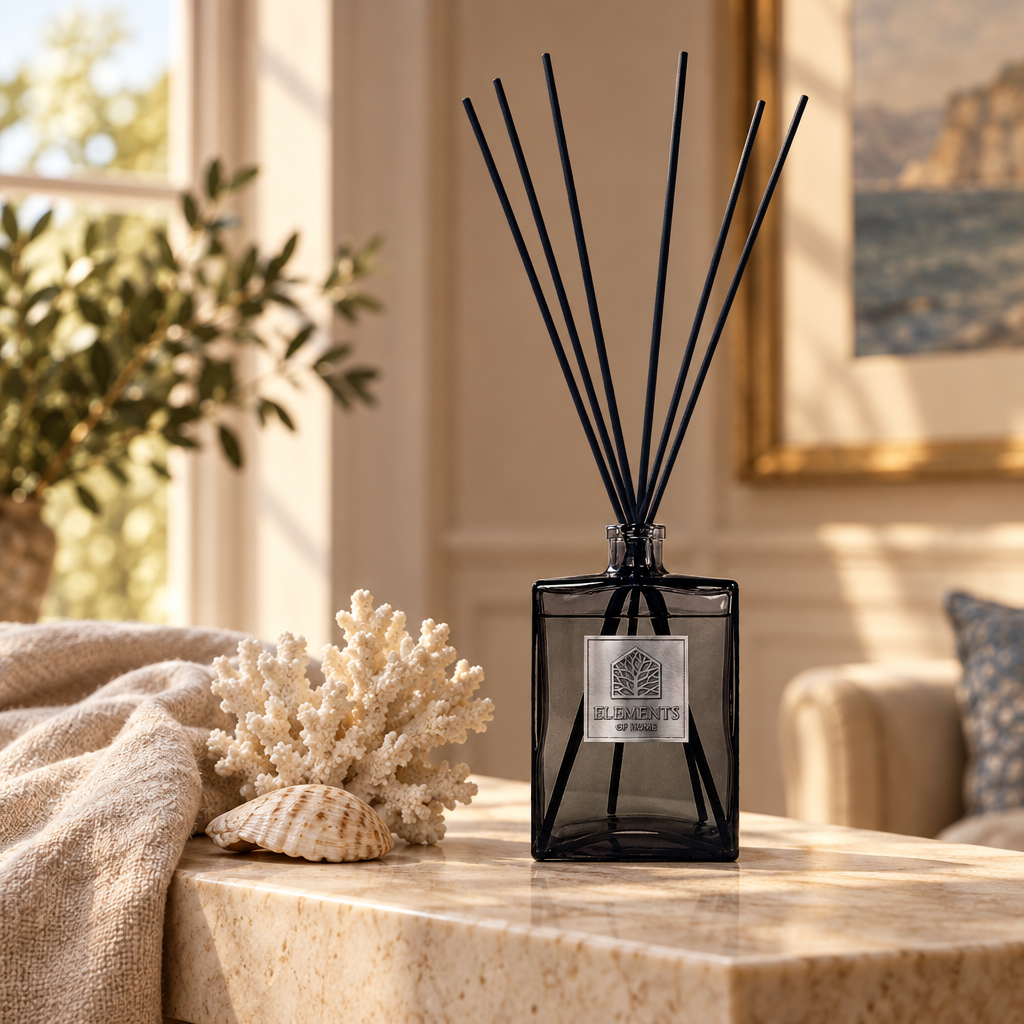 Oceanic 1L luxury reed diffuser in a black glass bottle styled in a sunlit living room – Elements of Fragrance