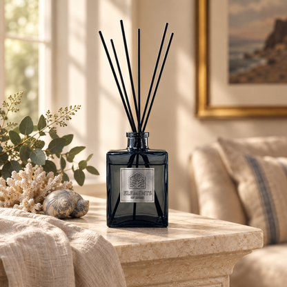 Oceanic 200ml luxury reed diffuser in a black glass bottle styled in a sunlit living room – Elements of Fragrance
