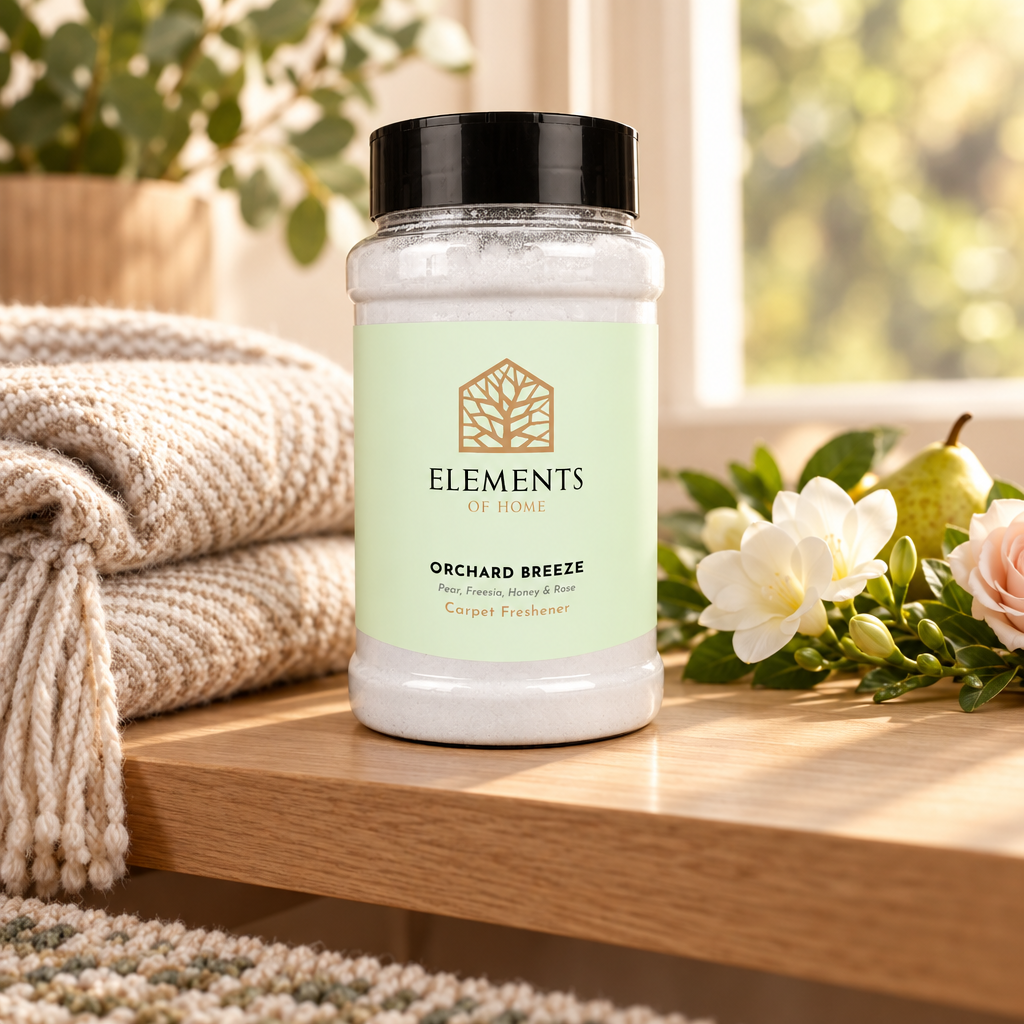 Orchard Breeze scented carpet sprinkles shaker tub on a wooden shelf with cosy throws – Elements of Fragrance