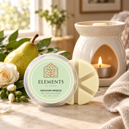 Orchard Breeze 50g soy wax melt snap pot beside a lit ceramic wax burner – Elements of Fragrance
