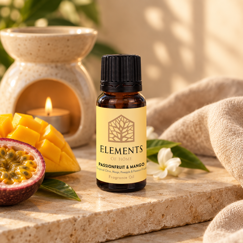 Passionfruit & Mango fragrance oil 10ml bottle beside a lit ceramic oil burner – Elements of Fragrance