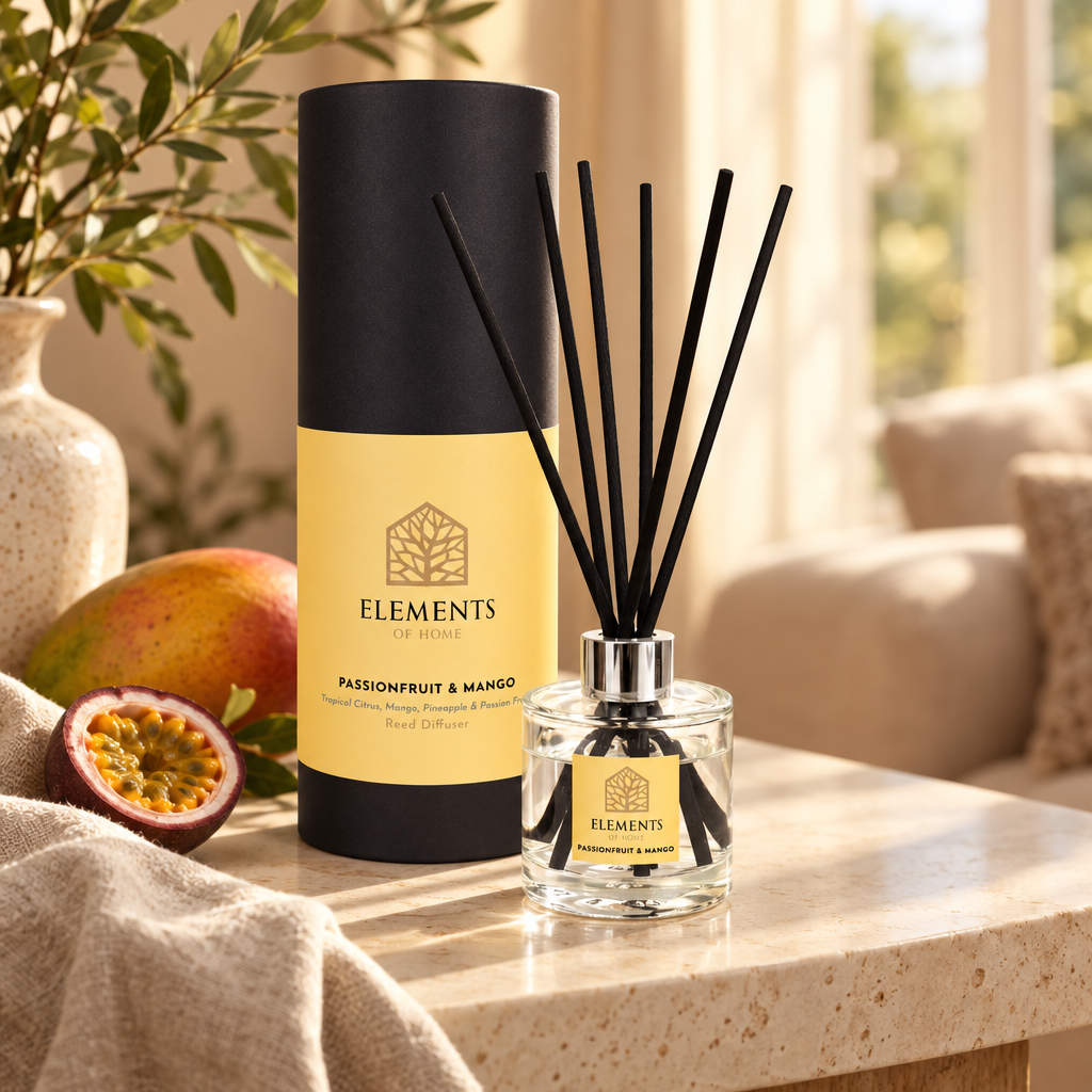 Passionfruit & Mango 100ml reed diffuser with black reeds styled in a sunlit living room – Elements of Fragrance