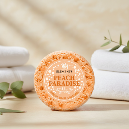 Peach Paradise triple butter soap sponge on a bathroom shelf with white towels – Elements of Fragrance