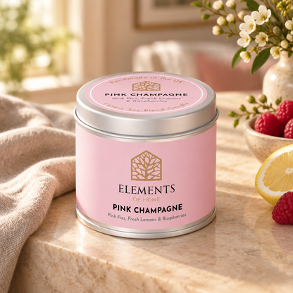 Pink Champagne scented candle in a 180g tin styled with fresh ingredients – Elements of Fragrance