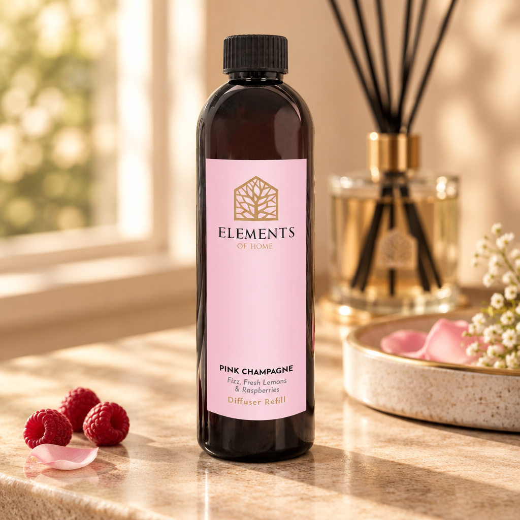 Pink Champagne reed diffuser refill bottle beside a reed diffuser – Elements of Fragrance