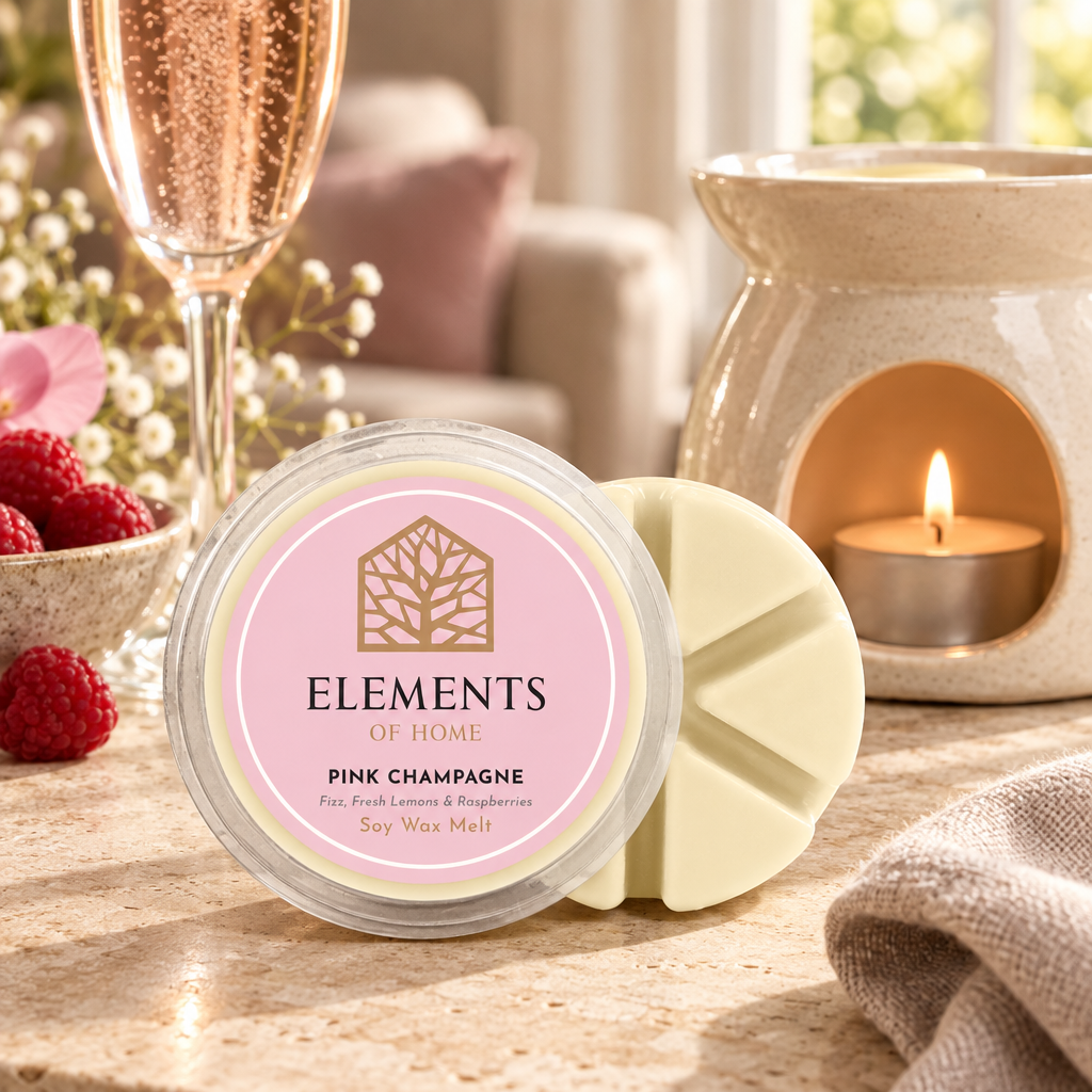 Pink Champagne 50g soy wax melt snap pot beside a lit ceramic wax burner – Elements of Fragrance
