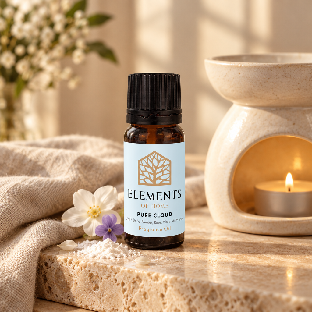 Pure Cloud fragrance oil 10ml bottle beside a lit ceramic oil burner – Elements of Fragrance