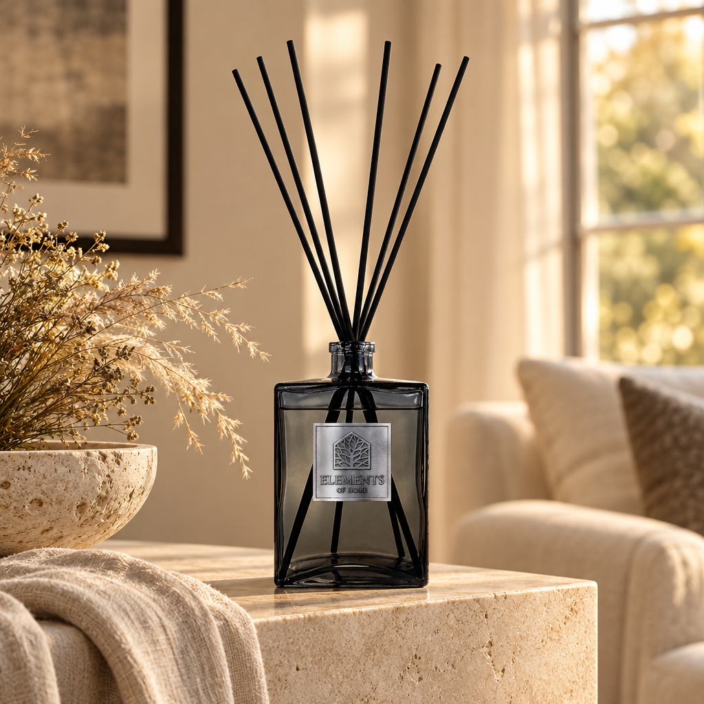 Sand Dunes 1L luxury reed diffuser in a black glass bottle styled in a sunlit living room – Elements of Fragrance