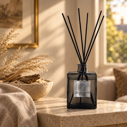 Sand Dunes 200ml luxury reed diffuser in a black glass bottle styled in a sunlit living room – Elements of Fragrance