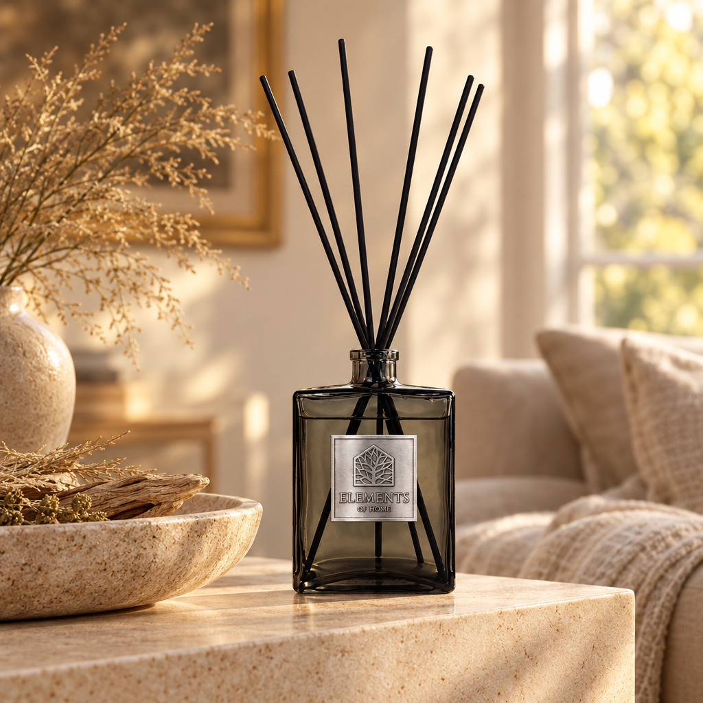 Sand Dunes 500ml luxury reed diffuser in a black glass bottle styled in a sunlit living room – Elements of Fragrance
