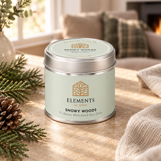 Snowy Woods scented candle in a 180g tin styled with fresh ingredients – Elements of Fragrance