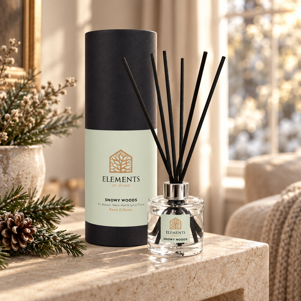 Snowy Woods 100ml reed diffuser with black reeds styled in a sunlit living room – Elements of Fragrance