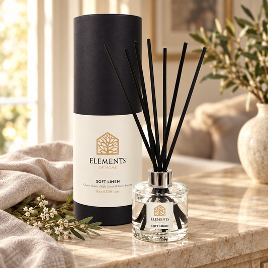 Soft Linen 100ml reed diffuser with black reeds styled in a sunlit living room – Elements of Fragrance
