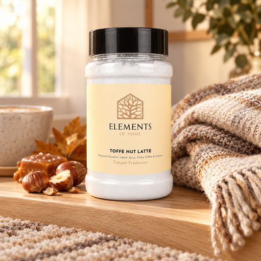 Toffee Nut Latte scented carpet sprinkles shaker tub on a wooden shelf with cosy throws – Elements of Fragrance