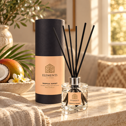 Tropical Sunset 100ml reed diffuser with black reeds styled in a sunlit living room – Elements of Fragrance