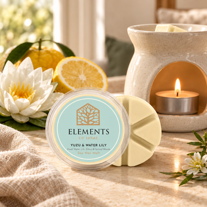 Yuzu & Waterlily 50g soy wax melt snap pot beside a lit ceramic wax burner – Elements of Fragrance