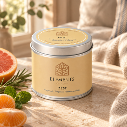 Zest scented candle in a 180g tin styled with fresh ingredients – Elements of Fragrance