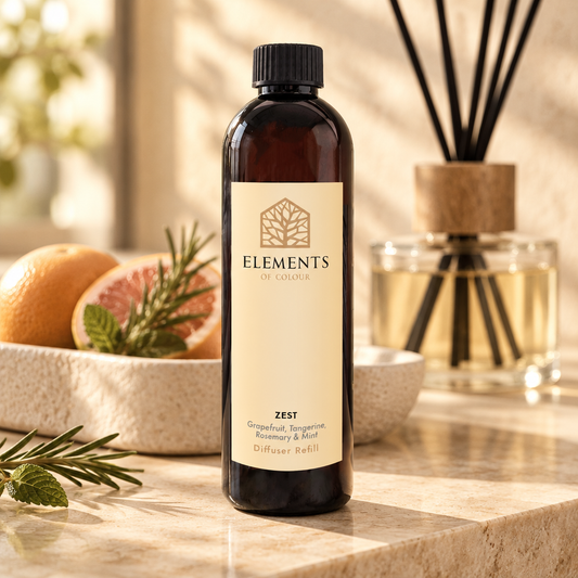 Zest reed diffuser refill bottle beside a reed diffuser – Elements of Fragrance