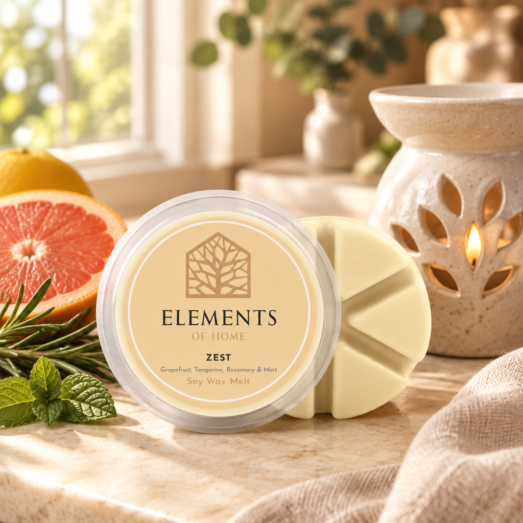Zest 50g soy wax melt snap pot beside a lit ceramic wax burner – Elements of Fragrance